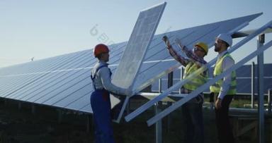 三名工人安装了太阳能电池板